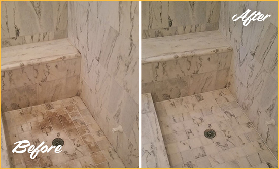 Before and After Picture of a Dirty Sea Bright Marble Shower Cleaned to Eliminate Dark Stains