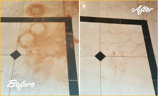 Before and After Picture of a Manalapan Hard Surface Restoration Service on a Marble Floor to Eliminate Rust Stains